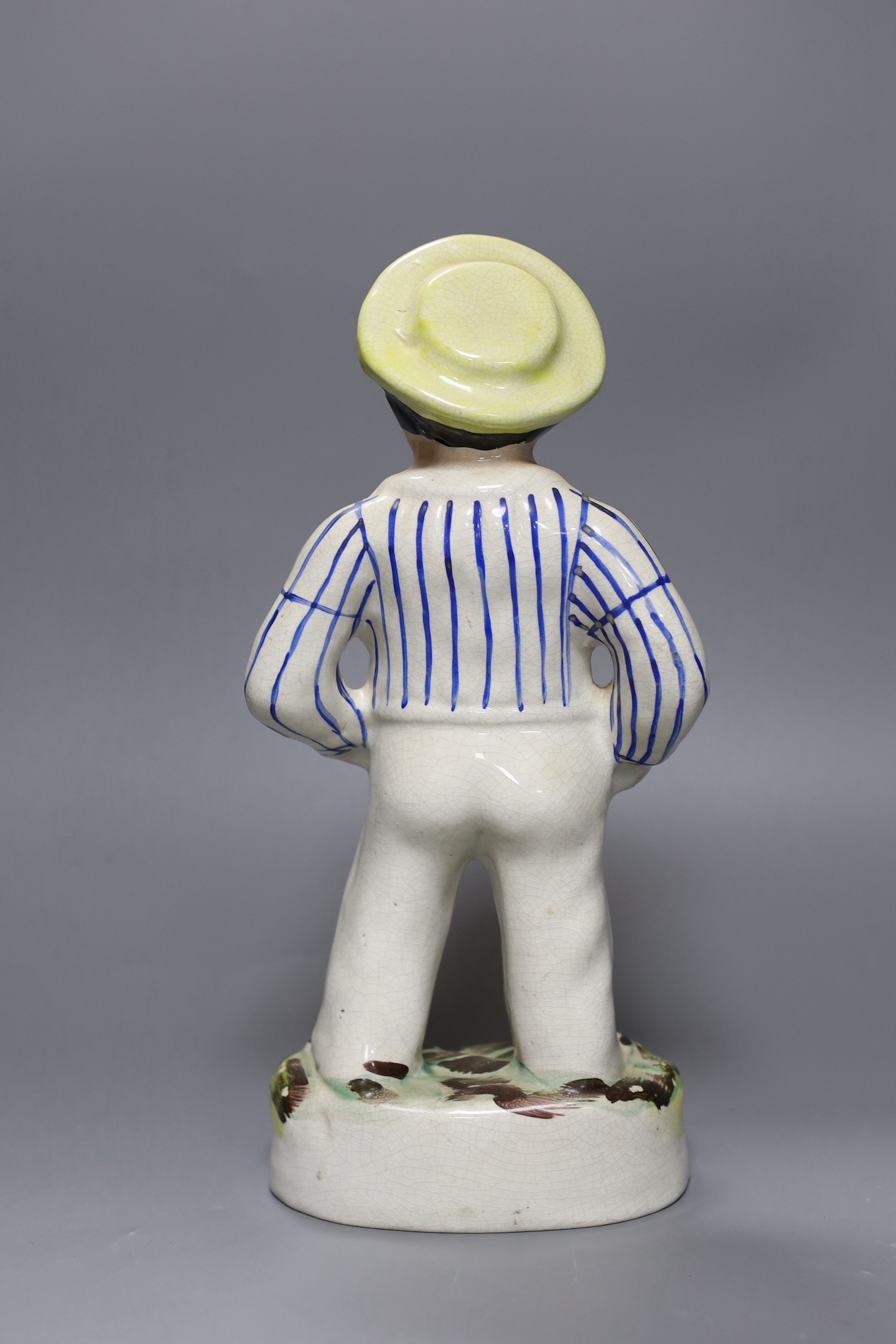 A Staffordshire pottery figure of a sailor, 33 cms high